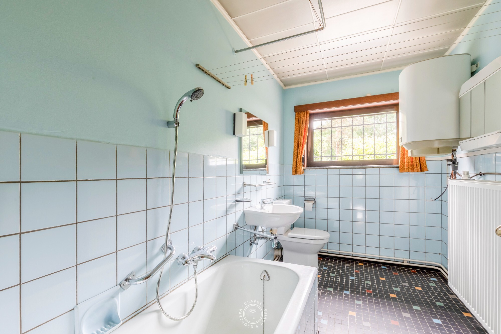 Open bebouwing met magazijn op een perceel van ca. 1.673 m²  in het centrum van Belsele