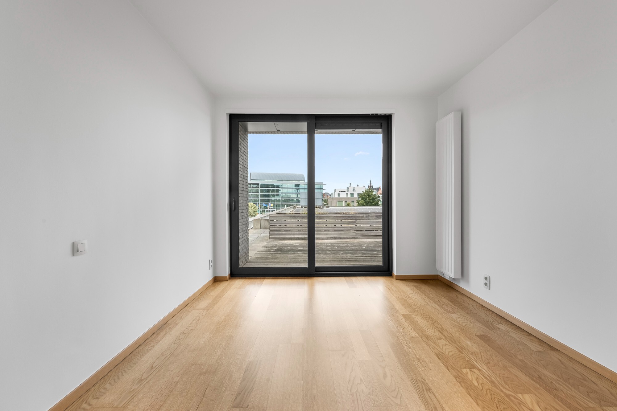 Lichtrijk appartement met Schelde-zicht, 2 slaapkamers en 2 parkeerplaatsen aan het Georges Van Dammeplein in Temse
