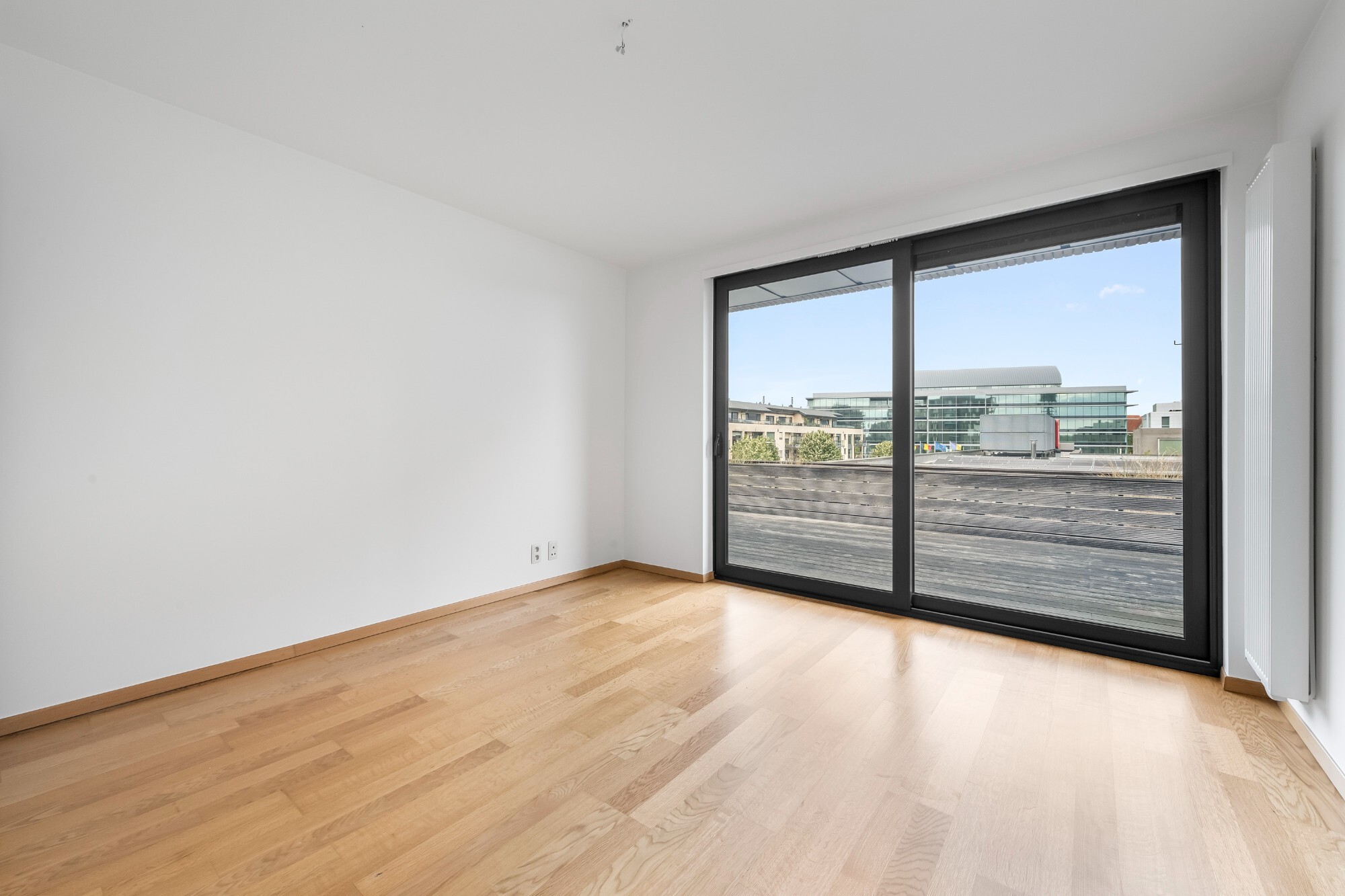 Lichtrijk appartement met Schelde-zicht, 2 slaapkamers en 2 parkeerplaatsen aan het Georges Van Dammeplein in Temse