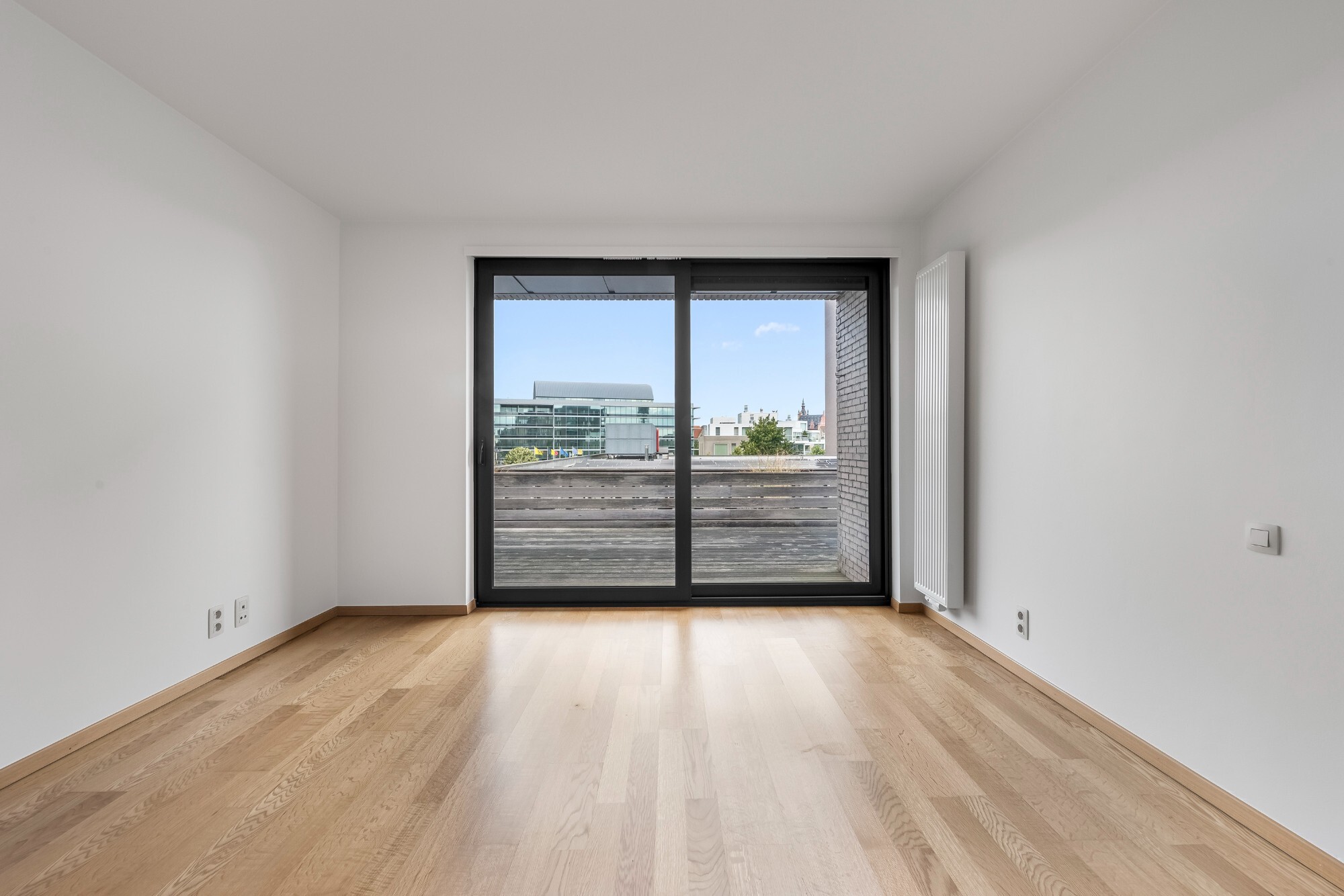 Lichtrijk appartement met Schelde-zicht, 2 slaapkamers en 2 parkeerplaatsen aan het Georges Van Dammeplein in Temse